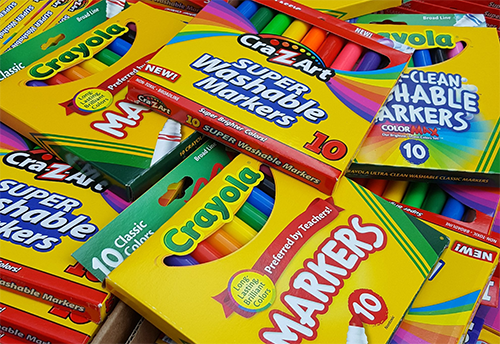 boxes of markers in a pile.